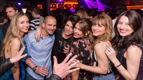 Coworkers enjoy their work function and relax.