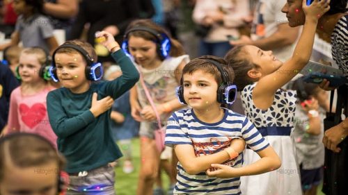 Children dancing and singing with the Kids Wireless Headphone Hire